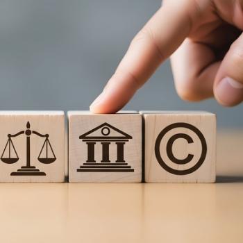 Wooden Blocks Displaying Copyright and Legal Icons